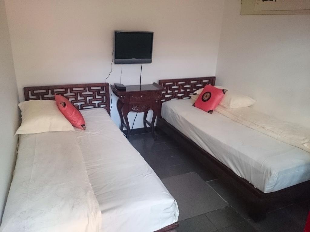 Templeside Deluxe Hutong Hotel Pekín Habitación foto